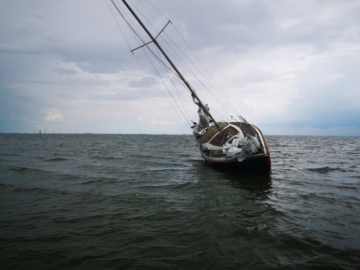 horizontal-shot-of-a-sailboat-in-a-sandbank-in-the-2025-02-02-20-20-56-utc
