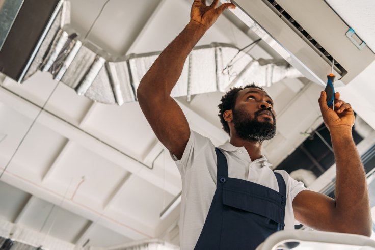 low-angle-view-of-african-american-handyman-repair-2024-11-18-22-51-05-utc (1)